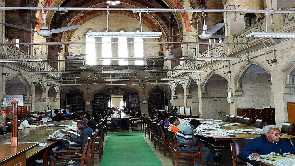 Historic reading hall inside Allahabad Public Library with books and study tables